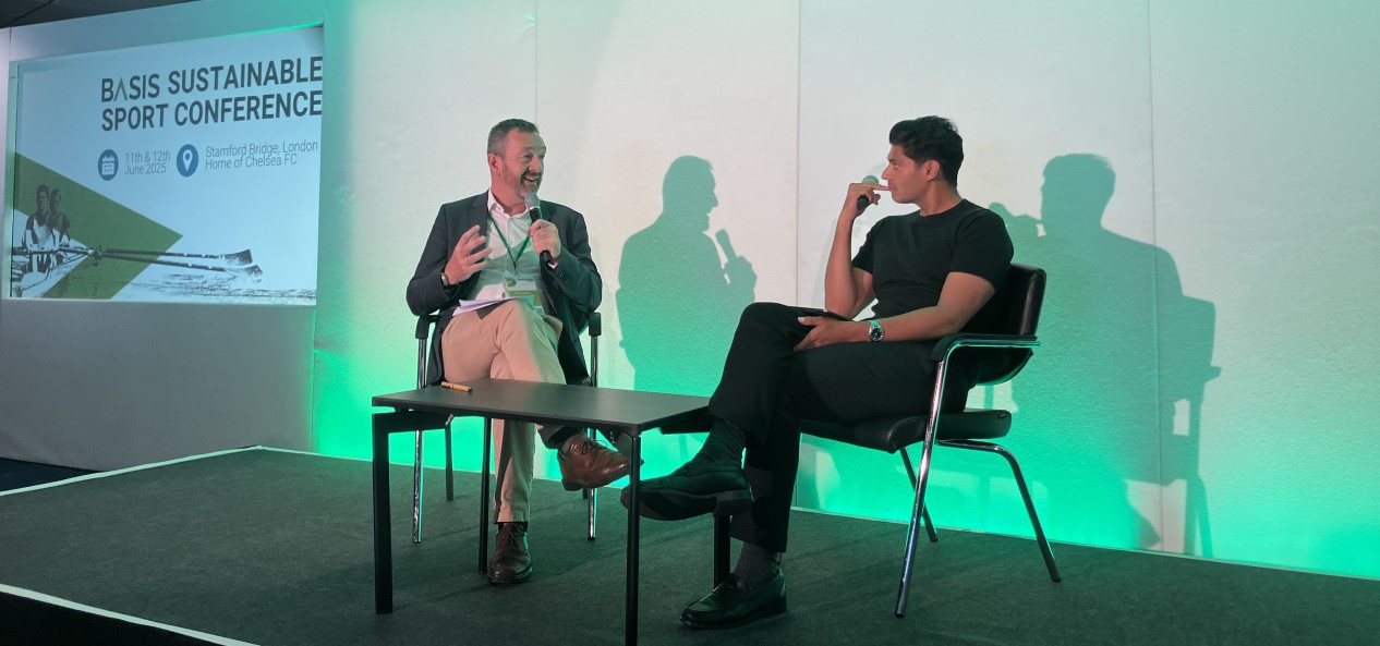 Chris Boardman and Qasa Alam sit talking on stage during the BASIS conference.